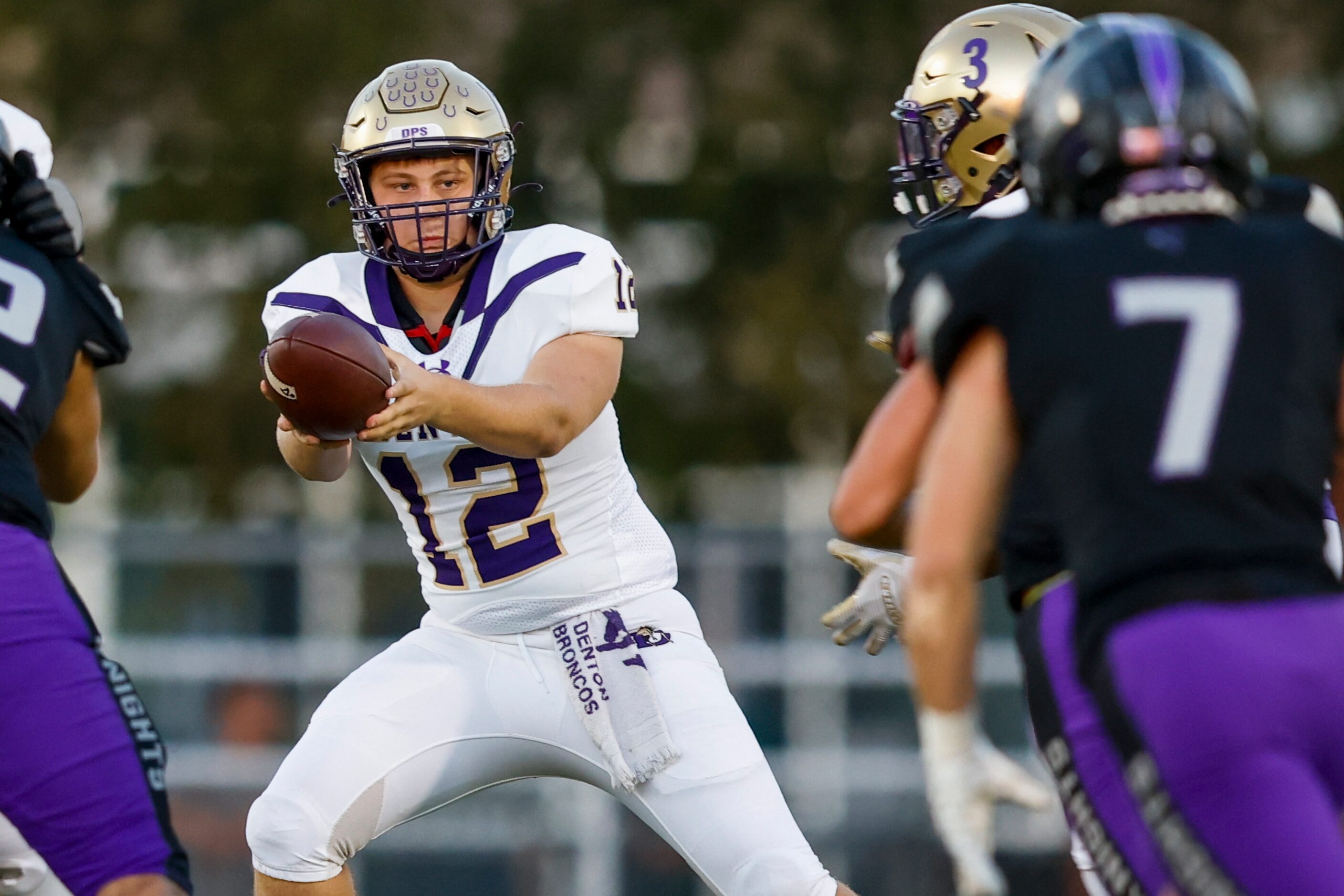 Dentons quarterback Jack Plunk looks towards the Frisco Independence defense during the...