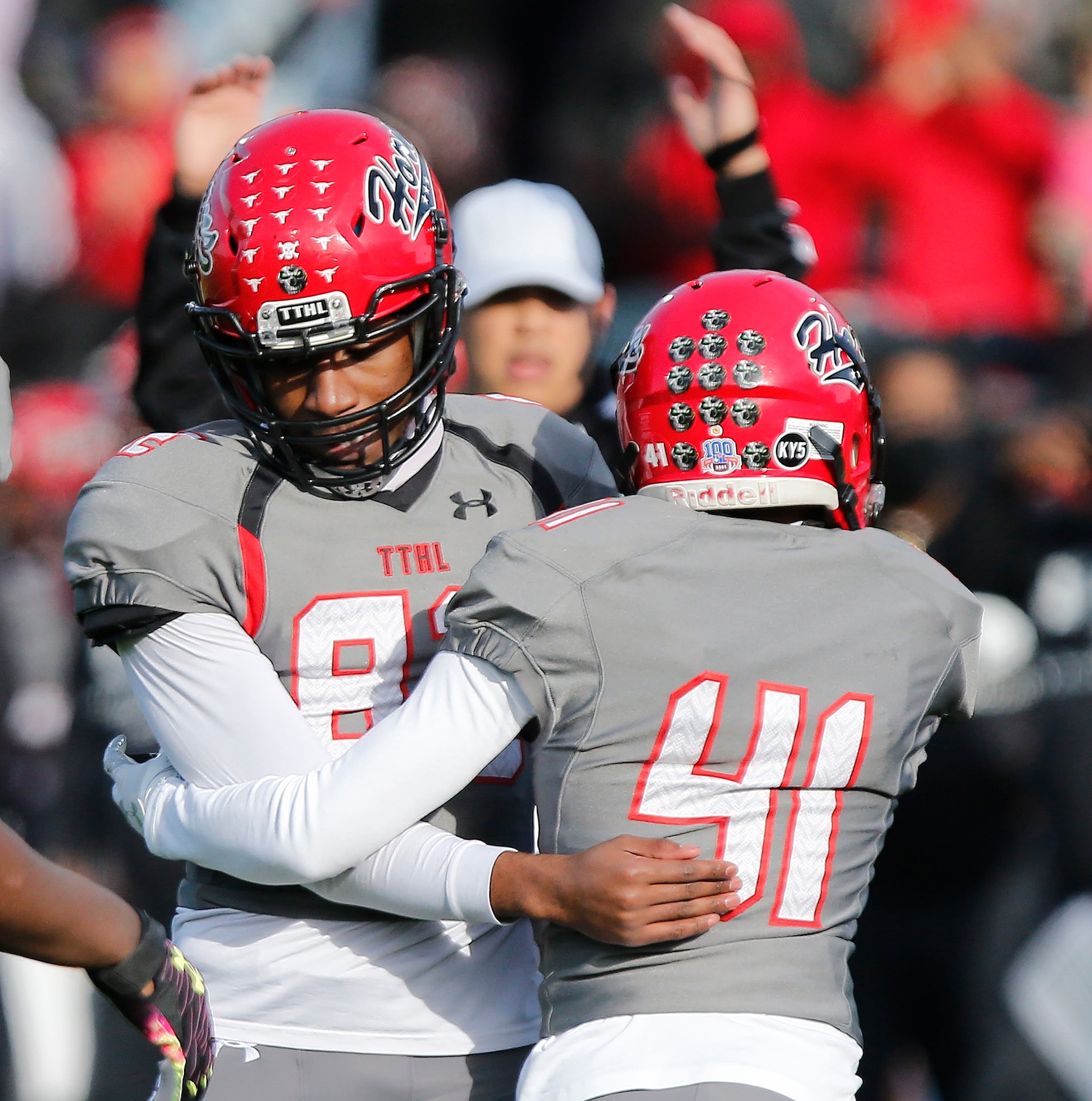 Cedar Hill High School kicker Jadon Cardell (82) is congratulated by his holder William...