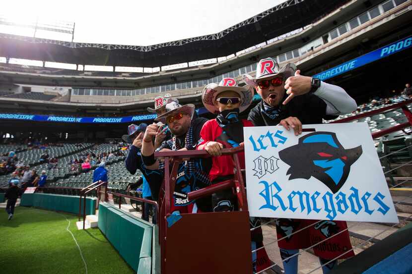 Dallas Renegades fans cheer as the team warms up before an XFL game between the Dallas...