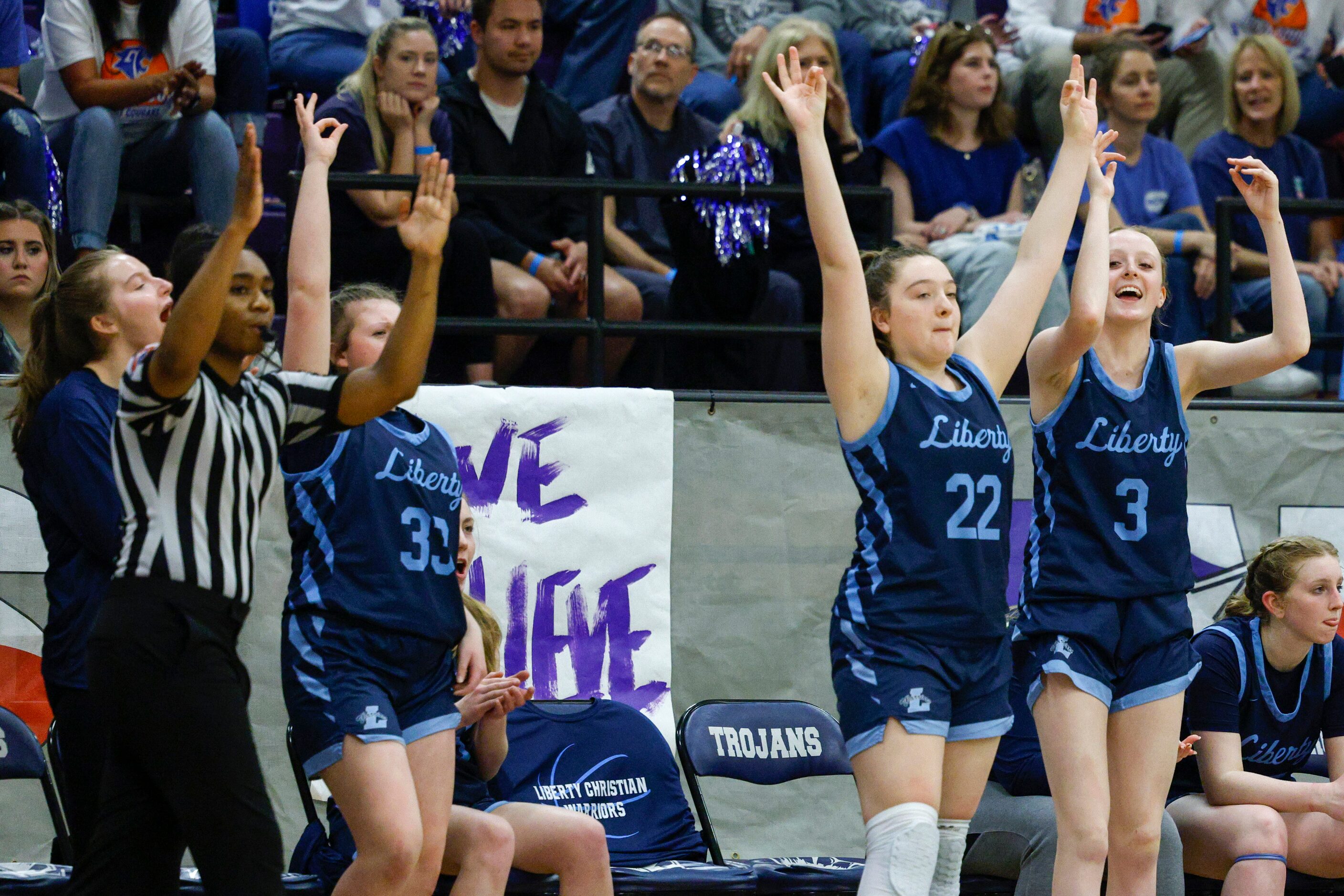 Argyle Liberty Christian players celebrate a three-point shot during the second half of a...