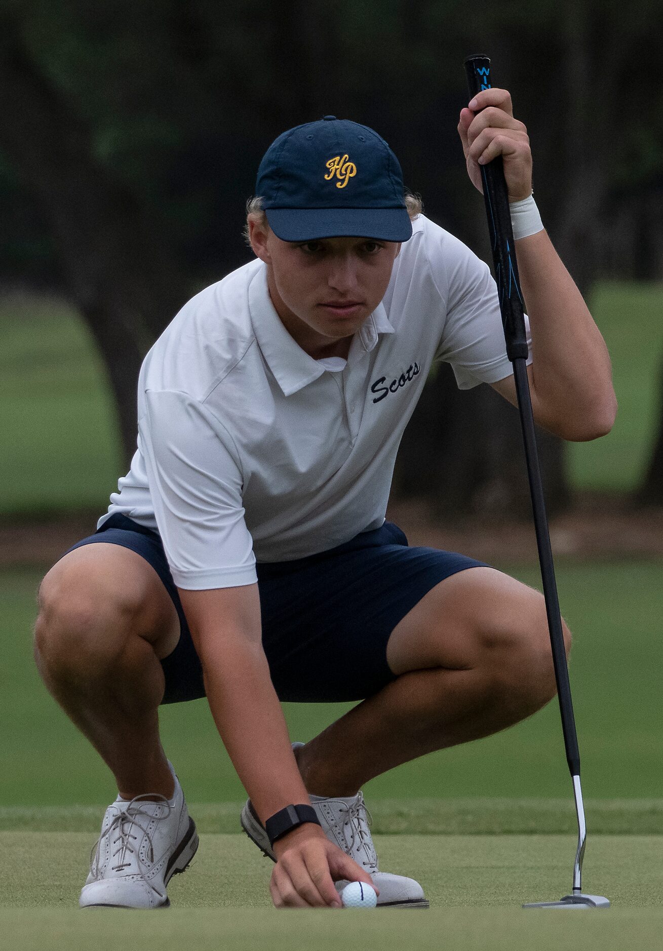 Highland Park gold Robert Boyce, lines up a putt on no. 1 green during the final round of...