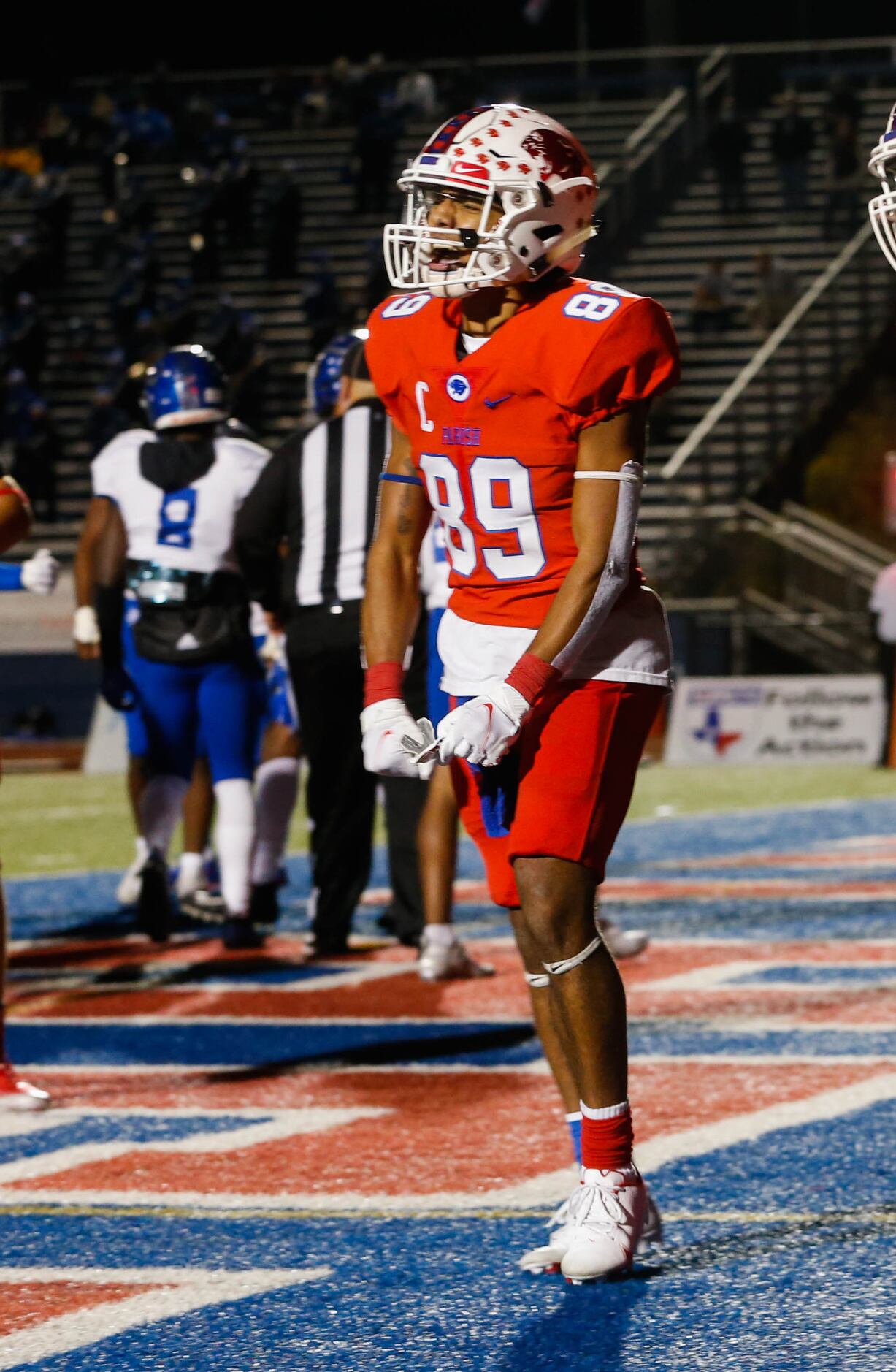 Parish Episcopal's Jai Moore (89) celebrates his team's touchdown during the first half of a...
