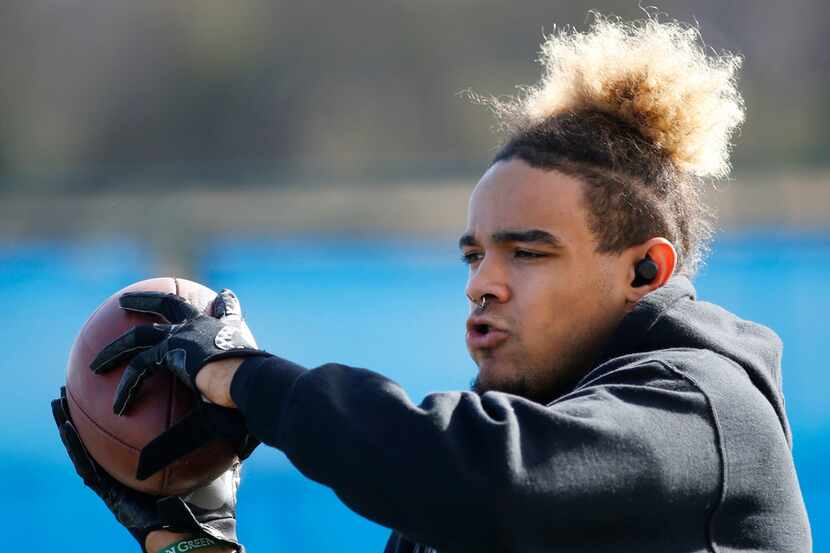 North Texas wide receiver Jalen Guyton catches footballs during a workout on media day at...