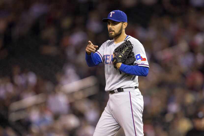 May 28, 2014; Minneapolis, MN, USA; Texas Rangers relief pitcher Joakim Soria (28) points to...
