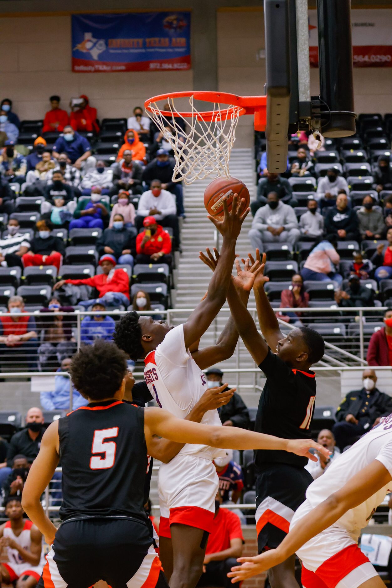 Lancaster's Jalen Williams (11) attempts to block Kimball's Kyron Henderson's layup during...