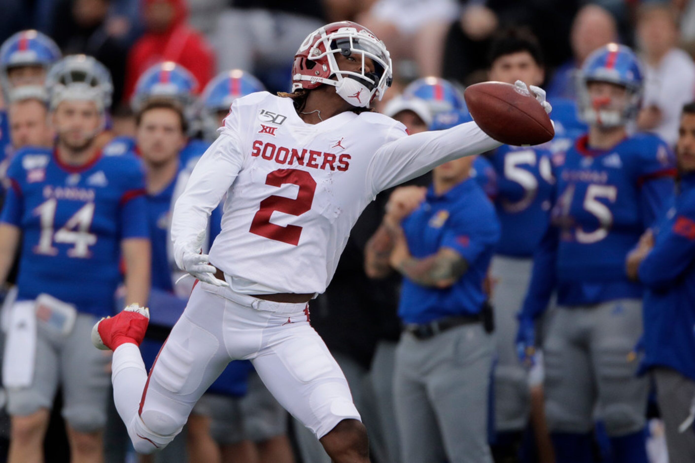 Oklahoma wide receiver CeeDee Lamb (2) reaches for but can't catch a long pass during the...