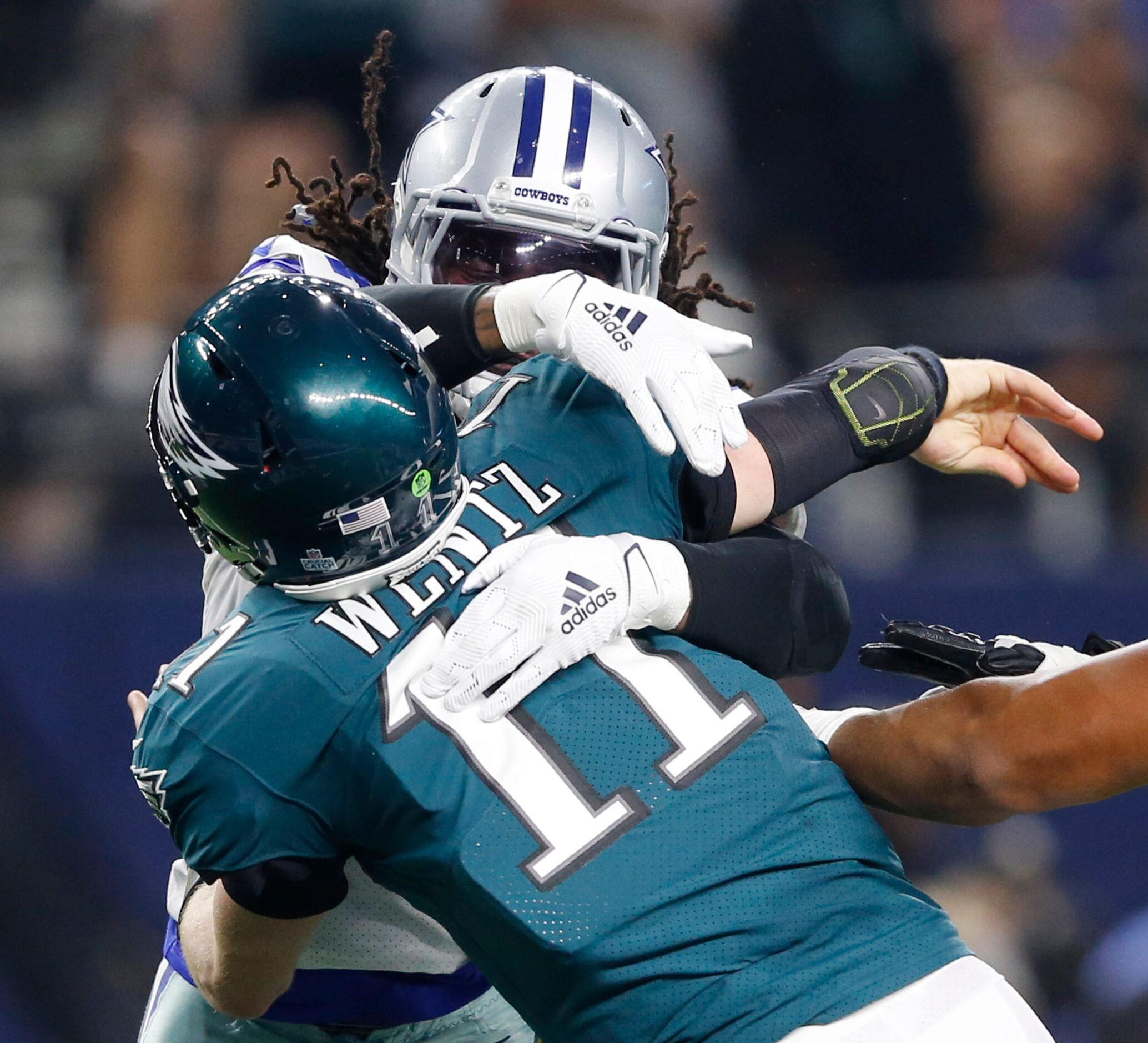 Dallas Cowboys middle linebacker Jaylon Smith (54) pressures Philadelphia Eagles quarterback...