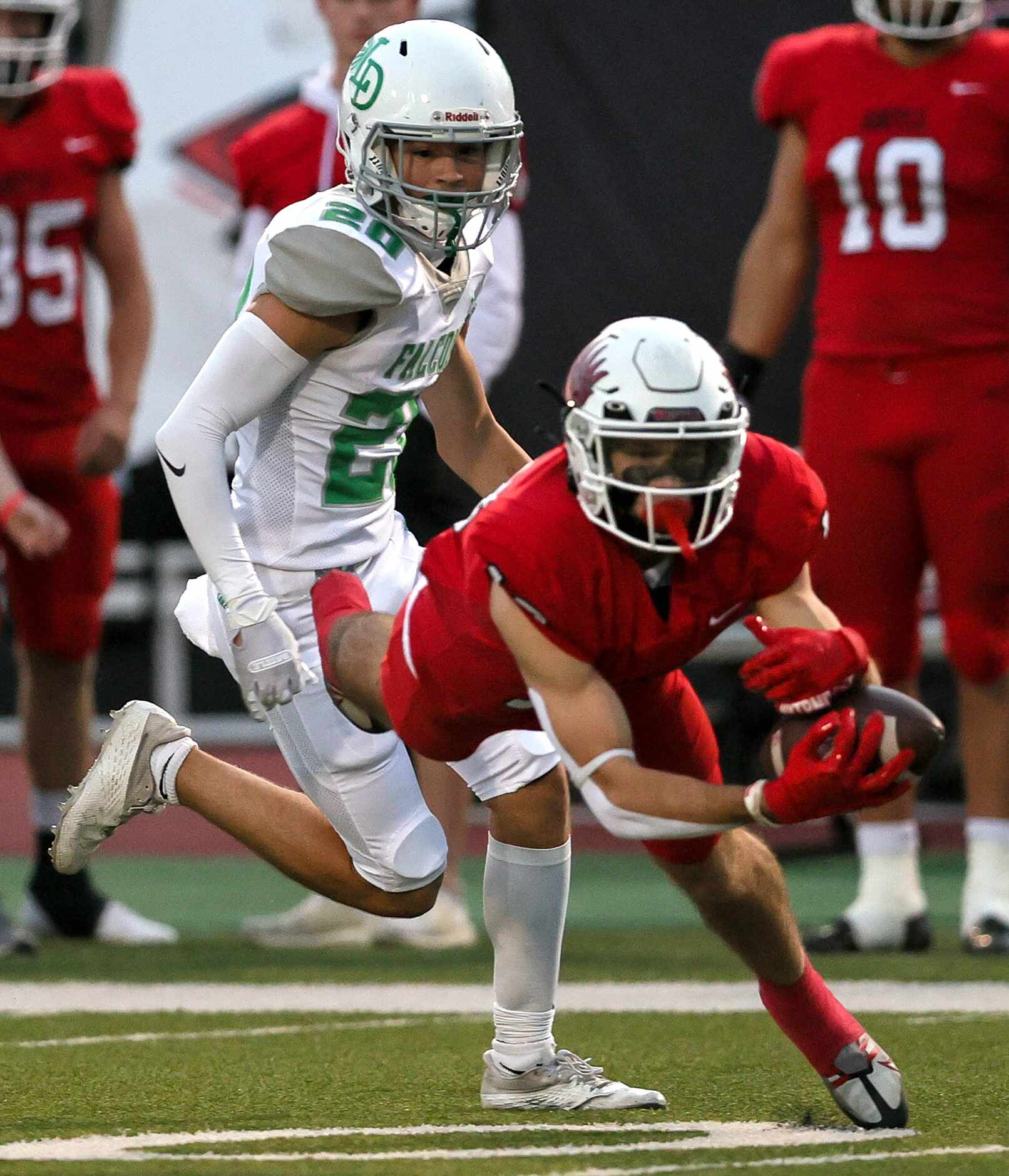 Argyle wide receiver Will Krzysiak (center) makes a great reception against Lake Dallas...