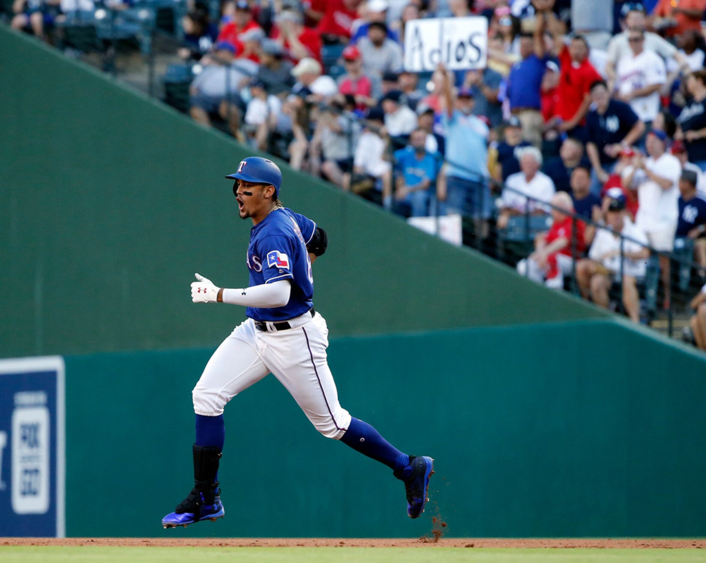 Texas Rangers Ronald Guzman (67) reacts after hitting a three-run home run off New York...