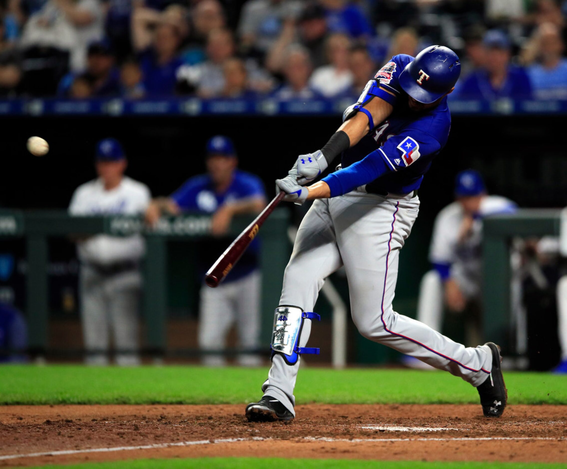 Texas Rangers' Ronald Guzman hits a two-run home run off Kansas City Royals starting pitcher...