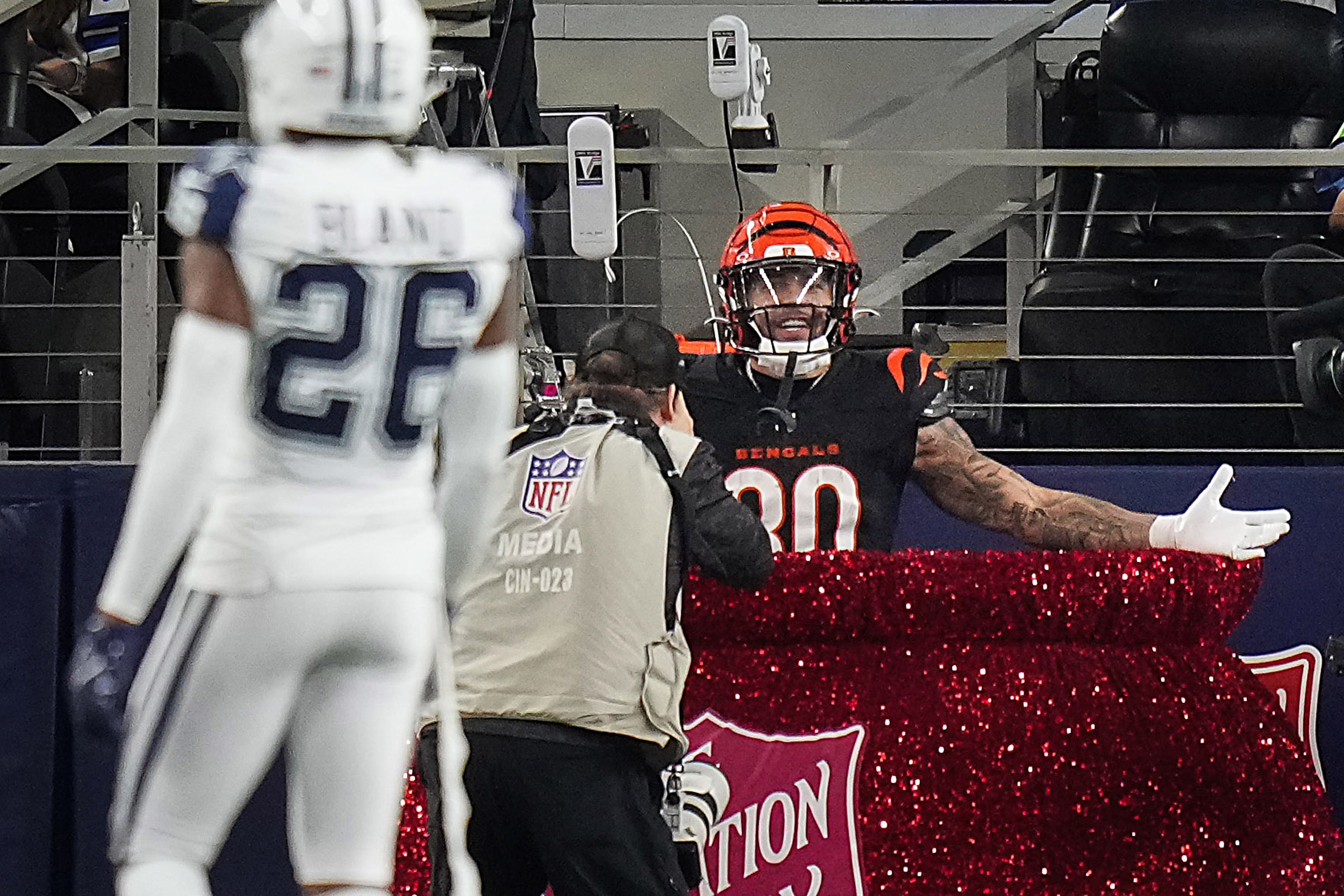 Cincinnati Bengals running back Chase Brown (30) celebrates a touchdown as Dallas Cowboys...