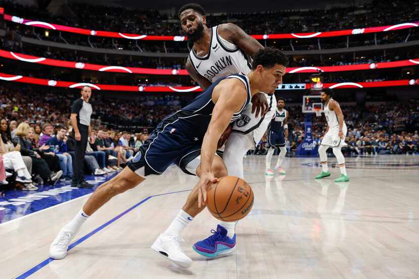 Dallas Mavericks guard Josh Green (8) dribbles around Brooklyn Nets forward Royce O'Neale...