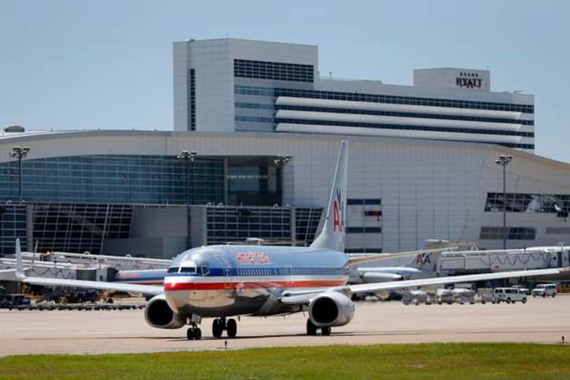 
An American Airlines jet taxis from Terminal D at Dallas/Fort Worth International Airport.

