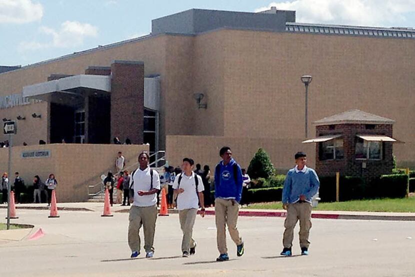 Students leave Duncanville High School at the end of school Wednesday, when near-riots...