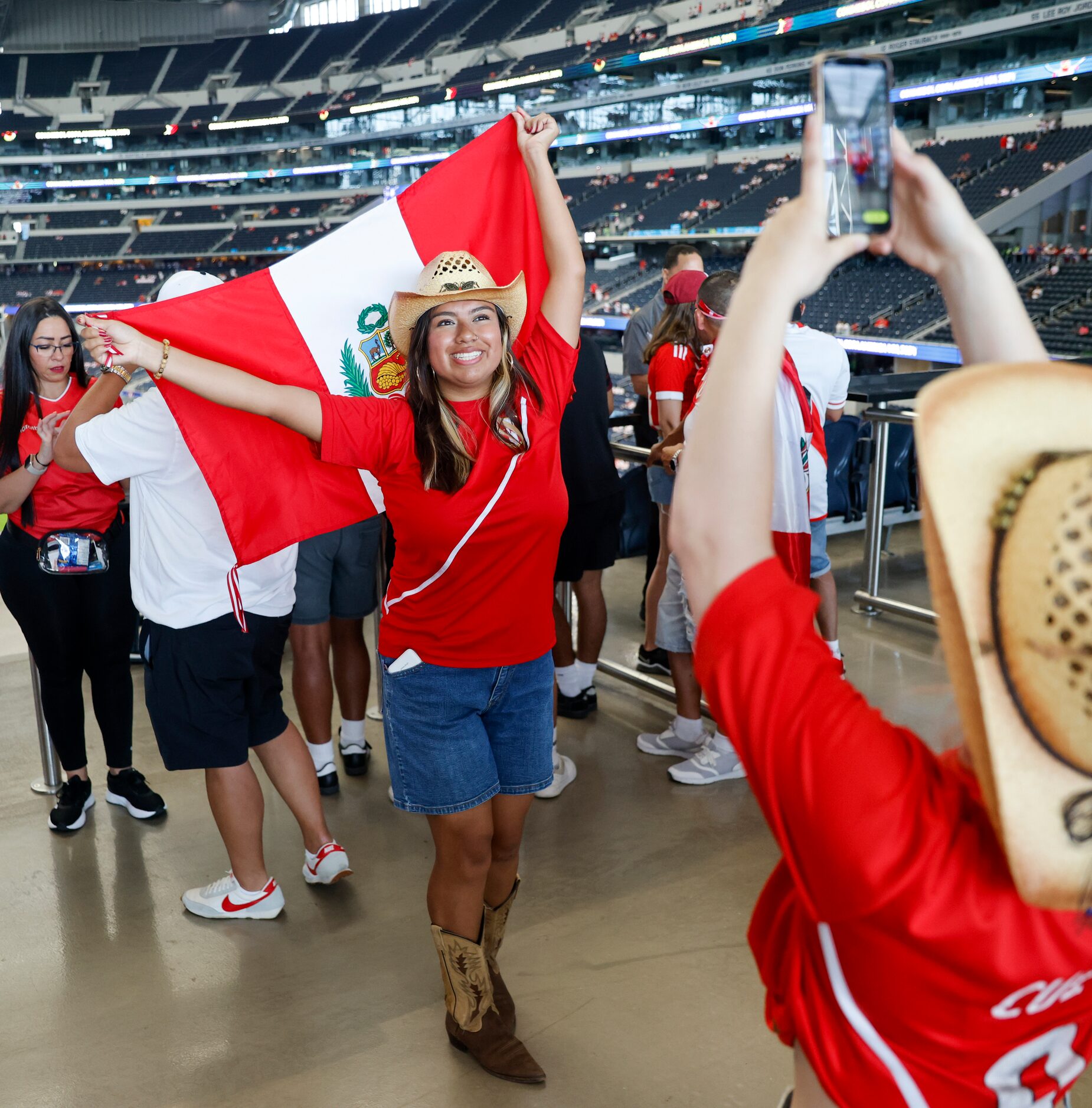 Yesenia Adrianzen of Chicago poses for a photo with the Peruvian flag before a Copa America...