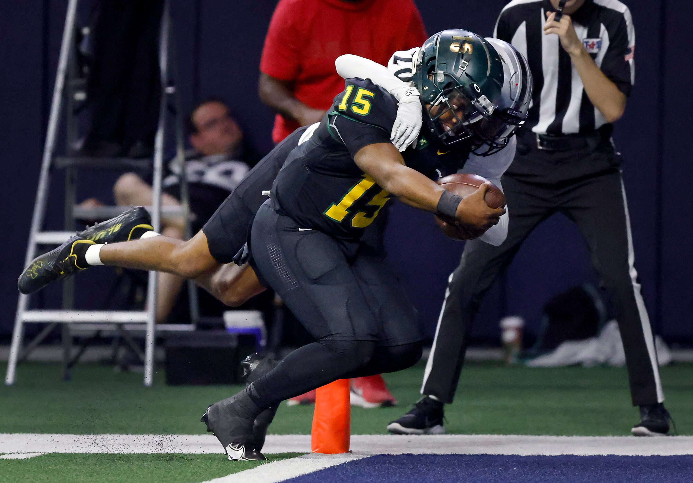 DeSoto quarterback Darius Bailey (15) carries Denton Guyer defensive back Brenden Bradshaw...