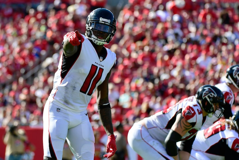 TAMPA, FLORIDA - DECEMBER 30: Julio Jones #11 of the Atlanta Falcons points to the sideline...