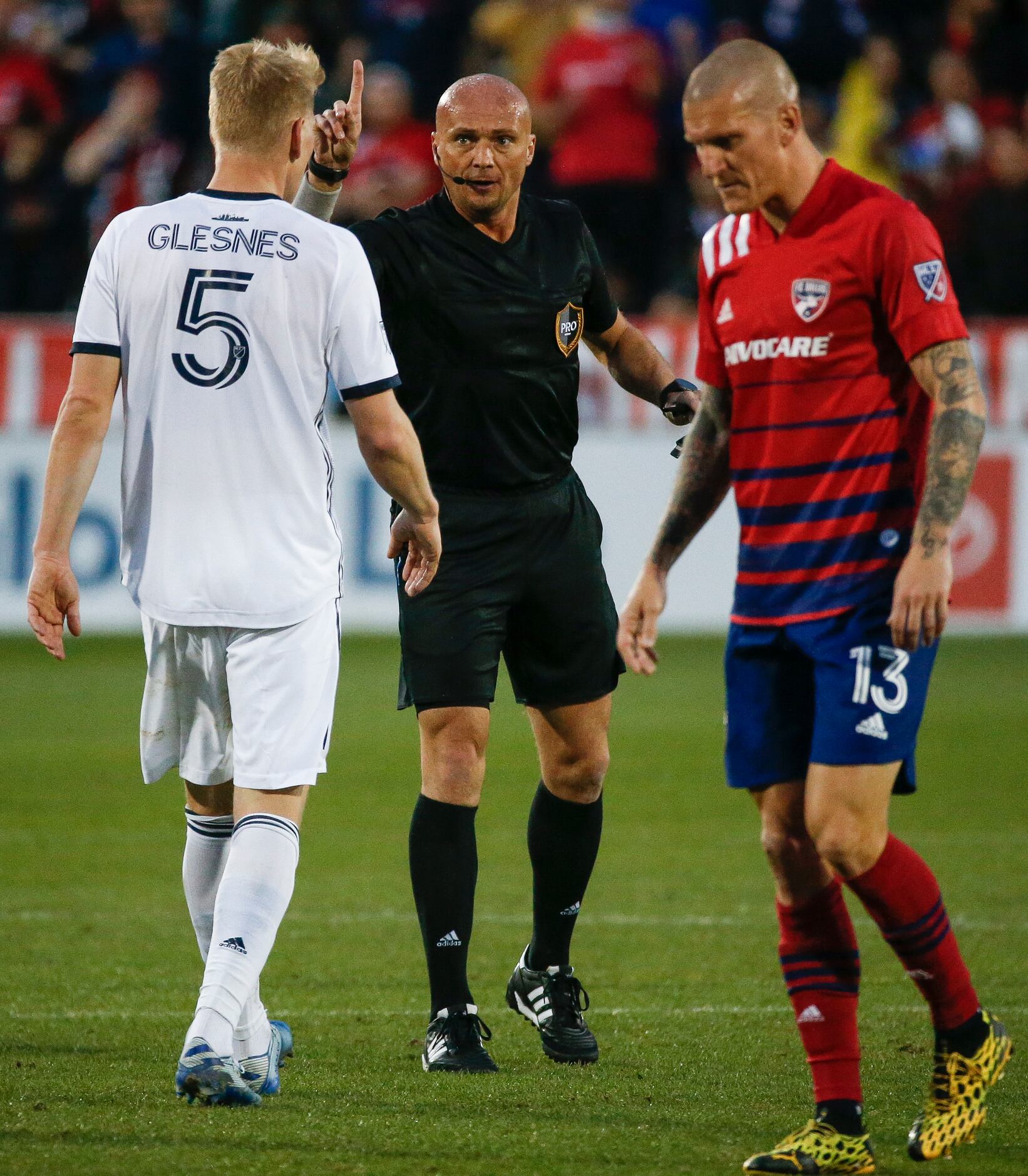 Philadelphia Union defender Jakob Glesnes (5) receives a warning after battling it out with...
