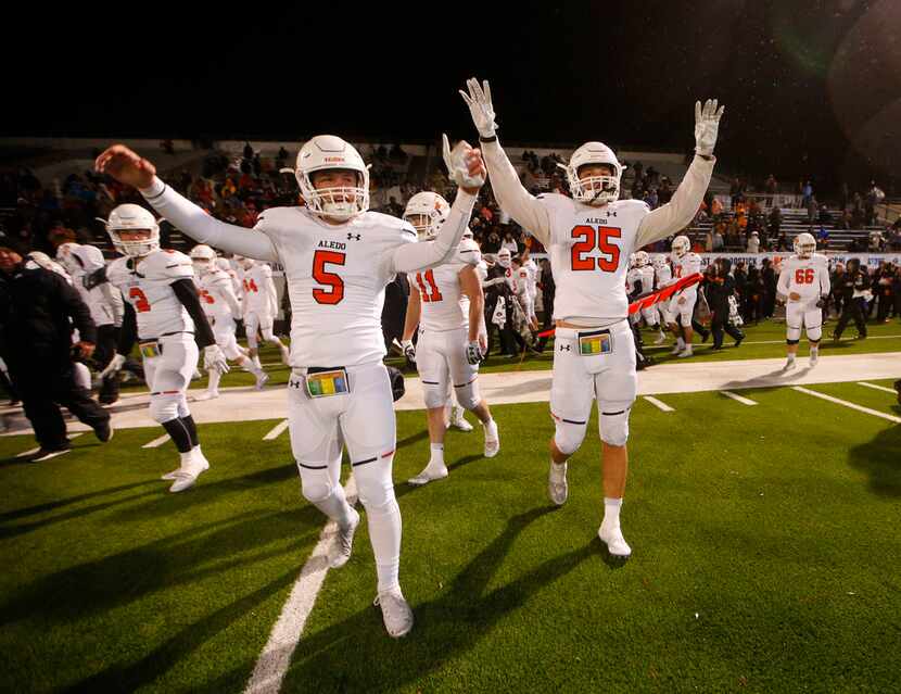 Aledo's Cade Jones (5) and Wyatt Harris (25) after beating Reedy to win the Class 5A...