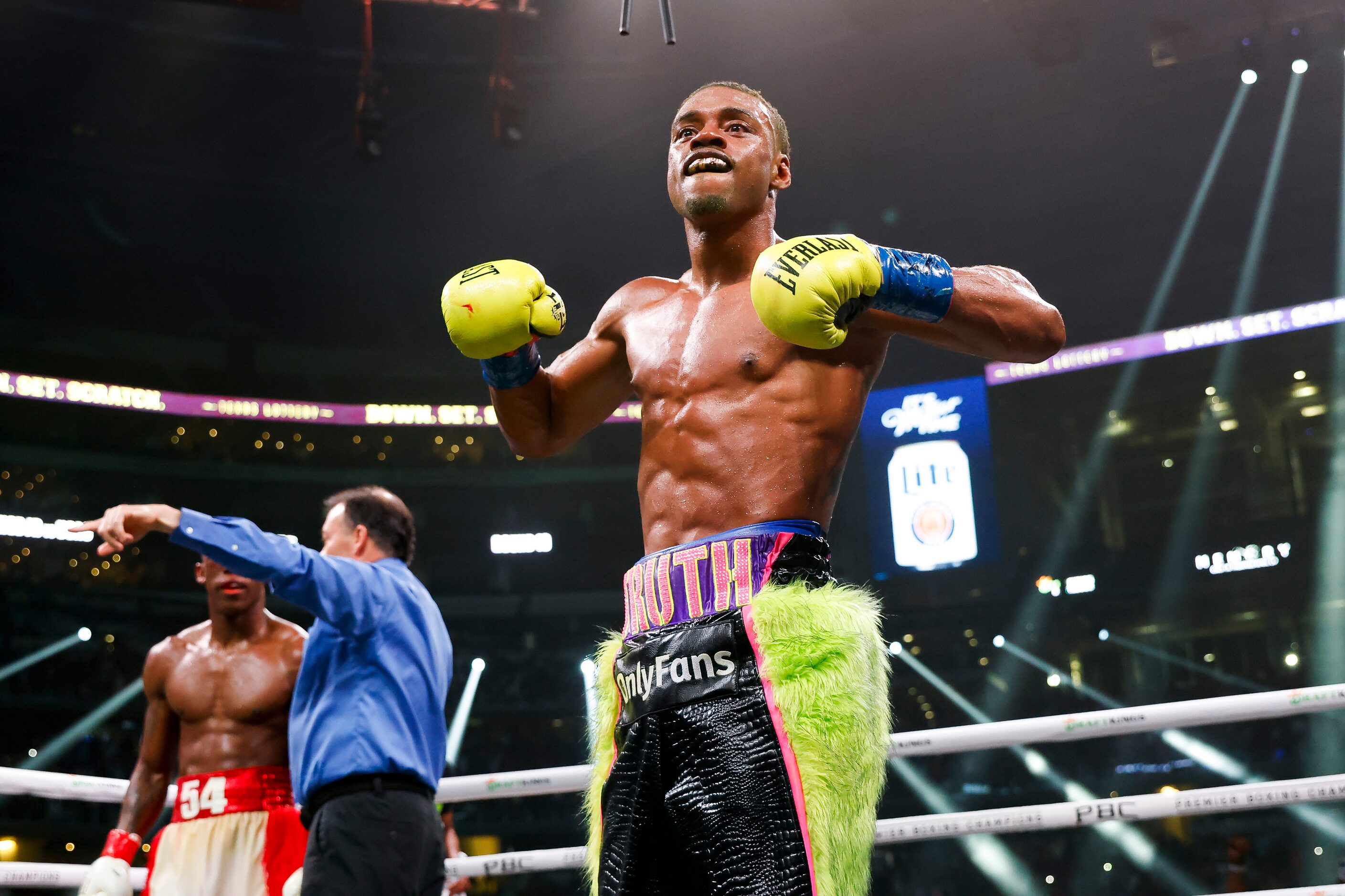 DeSoto’s Errol Spence Jr. (28-0) celebrates beating Yordenis Ugas (27-4), via a technical...