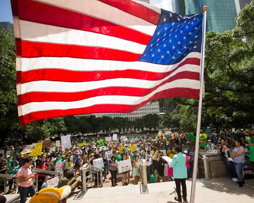 Rep. Sheila Jackson Lee, D-Texas, speaks to demonstrators following a march through downtown...