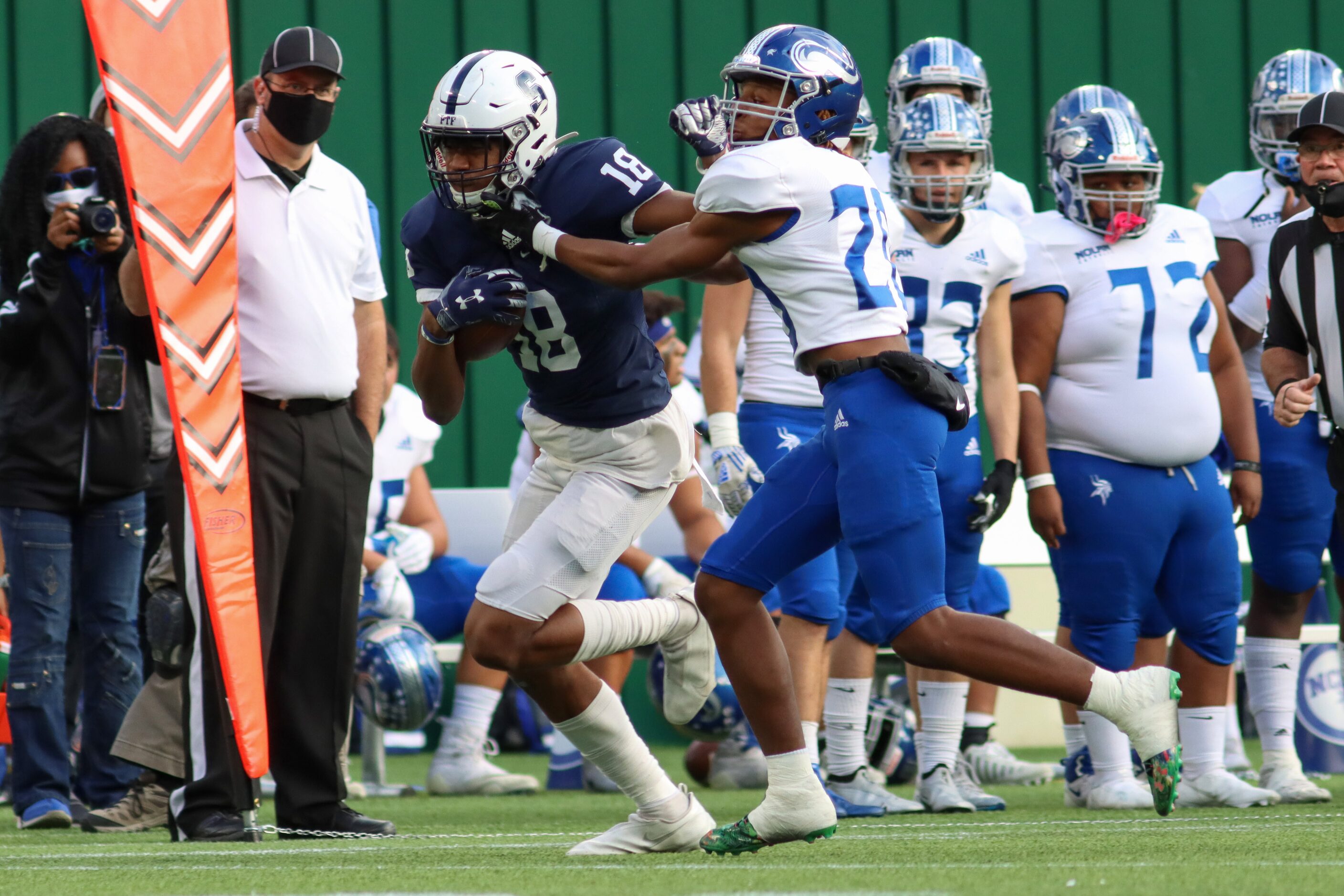 Fort Worth Nolan defensive back Niko Morris (20) tackles Fort Worth All Saints wide receiver...