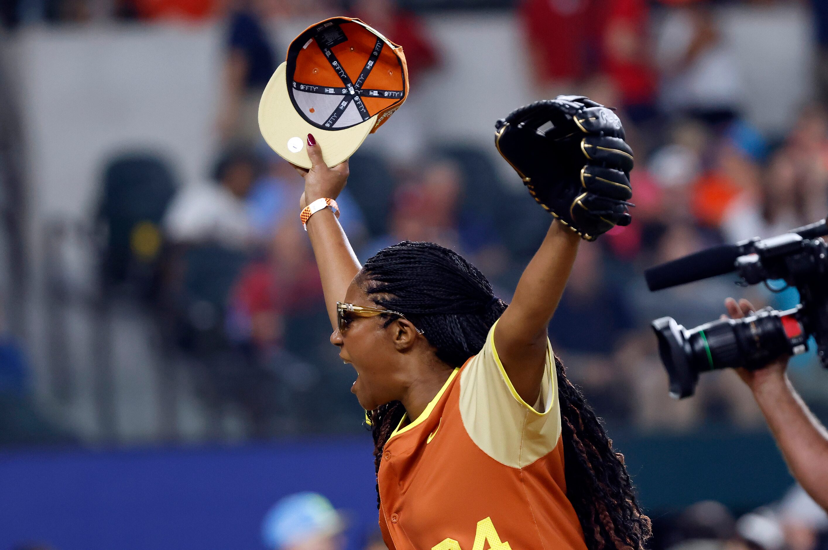 American League pitcher Tiffany Haddish reacts after catching a pop-up by National League...