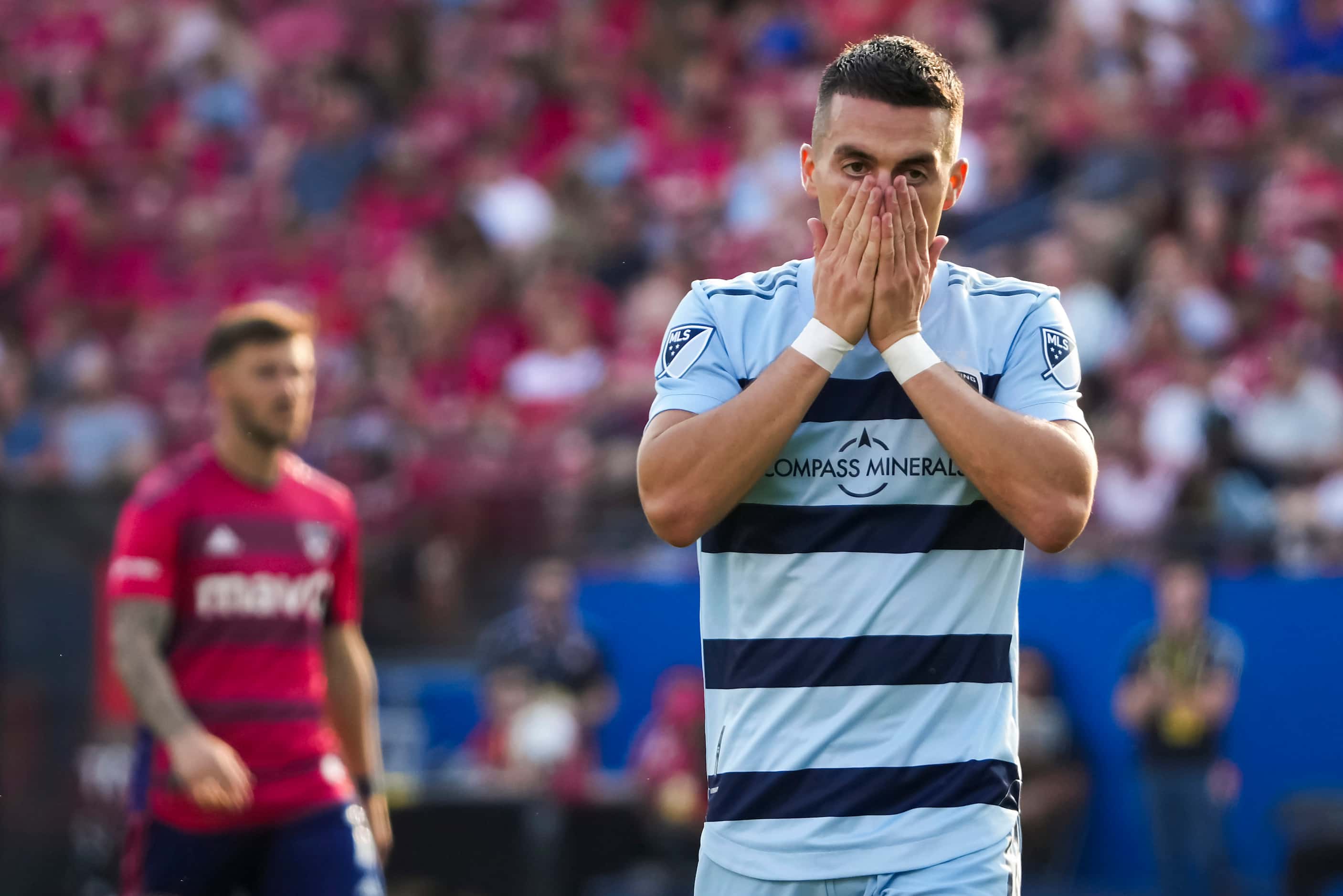 Sporting Kansas City midfielder Erik Thommy (26) reacts after missing a shot during the...
