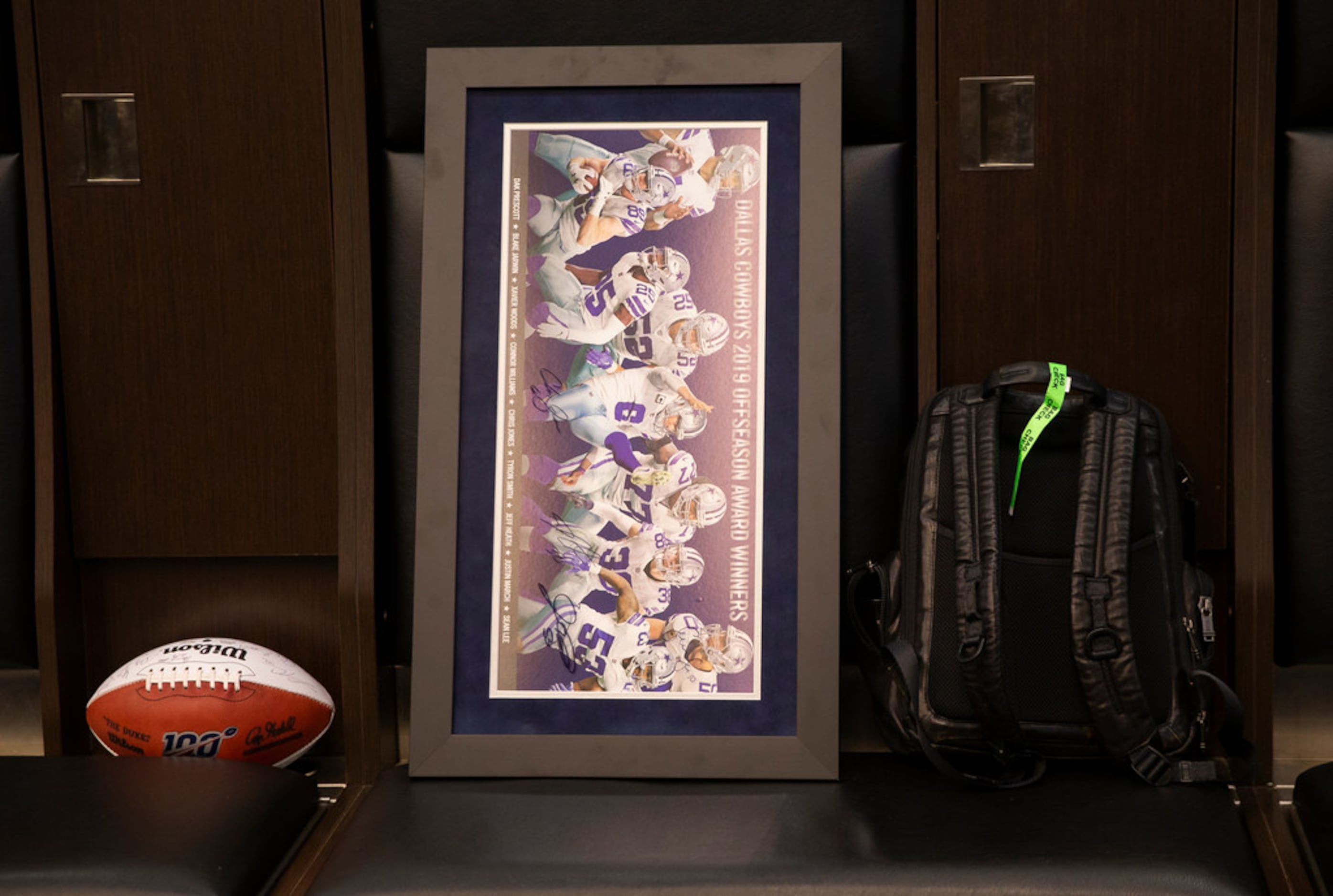 A framed Dallas Cowboys photo in front of TE Blake Jarwin's (89) locker at The Star on Dec....