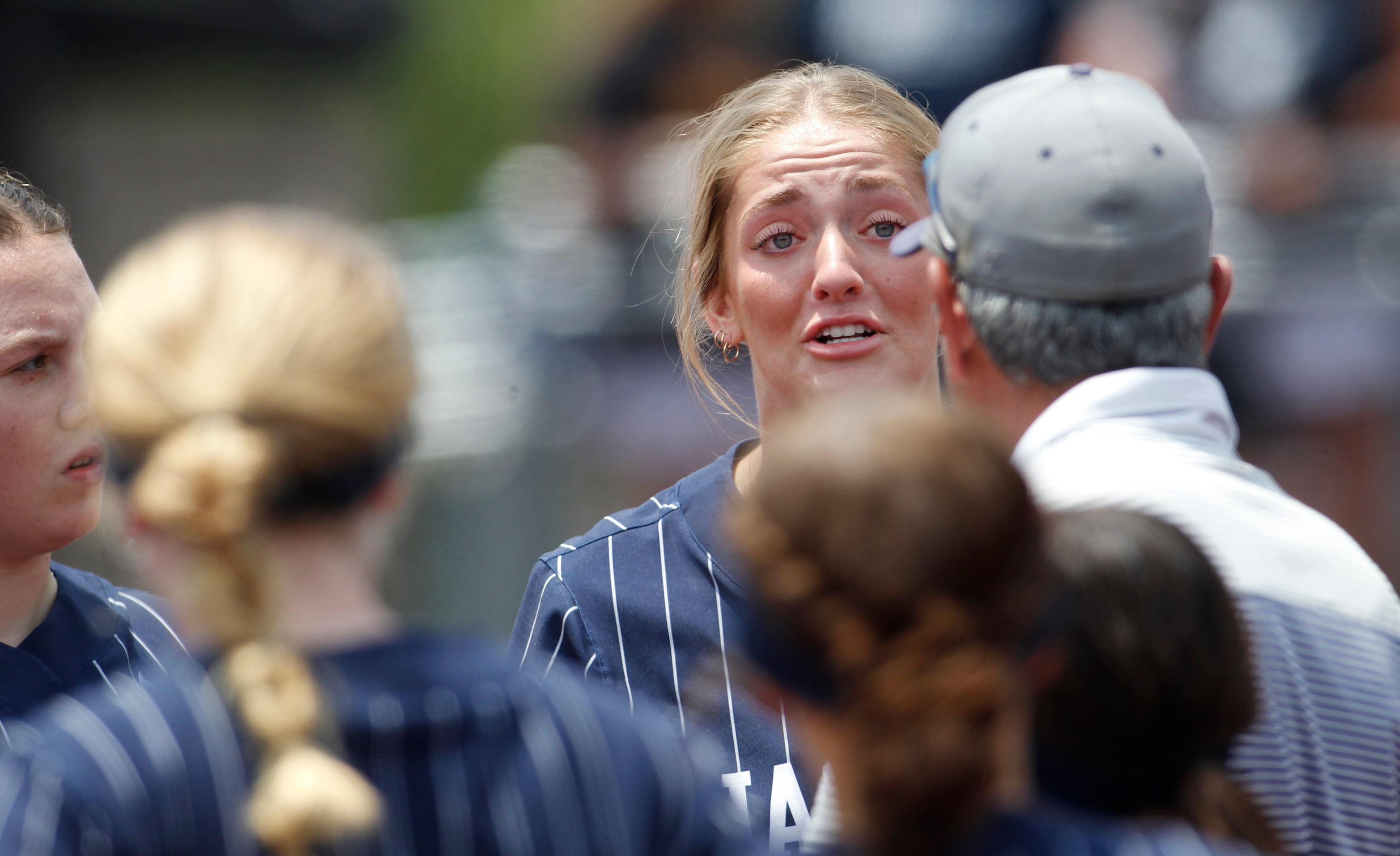 Flower Mound pitcher Landry Harris (15) reacts while conversing with head coach Mark Laribba...