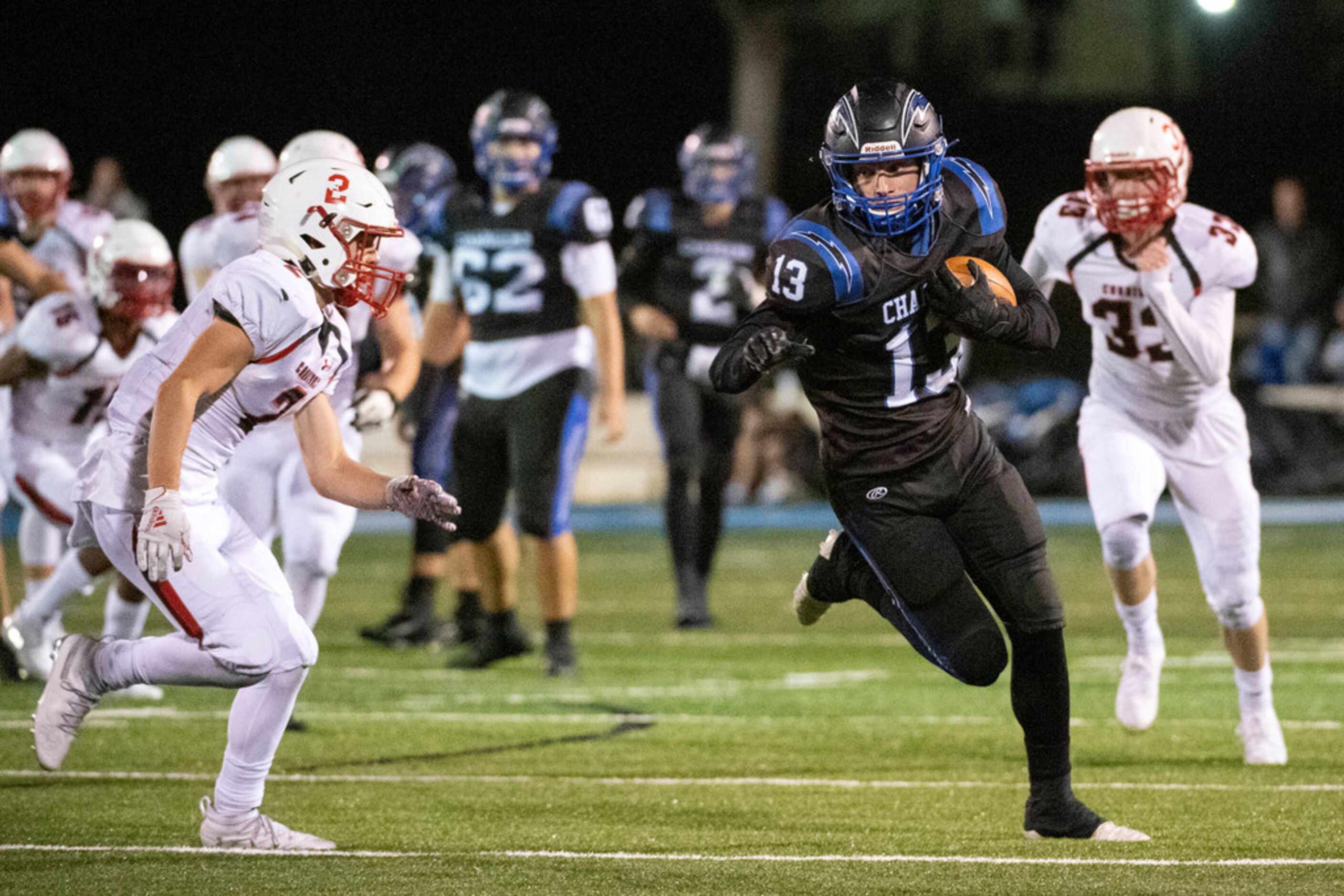 Dallas Christian senior wide receiver Justin Vaught (13) turns upfield against Fort Worth...