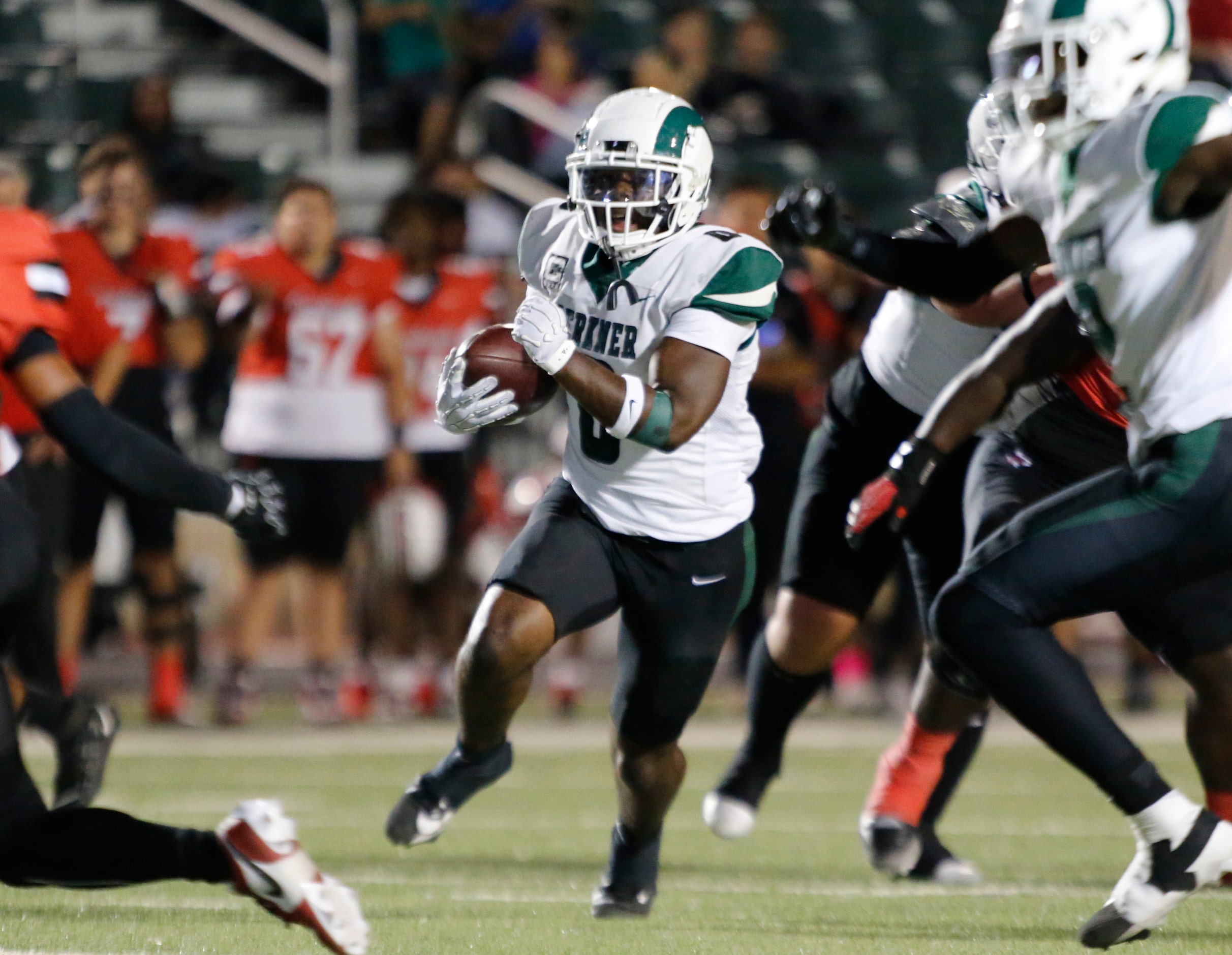 Richardson Berkner High’s Donte Doyle (0) runs for a first down during the first half of a...