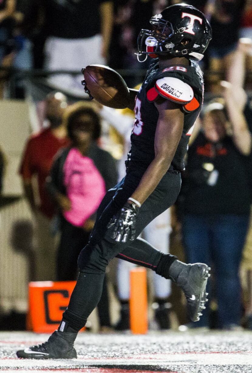 Euless Trinity Ja'Ron Wilson (28) runs in to the end zone for a touchdown during the fourth...