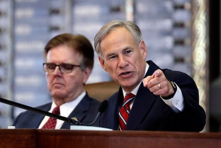 Texas Gov. Greg Abbott (right) speaks during his 2019 State of the State address as Lt. Gov....
