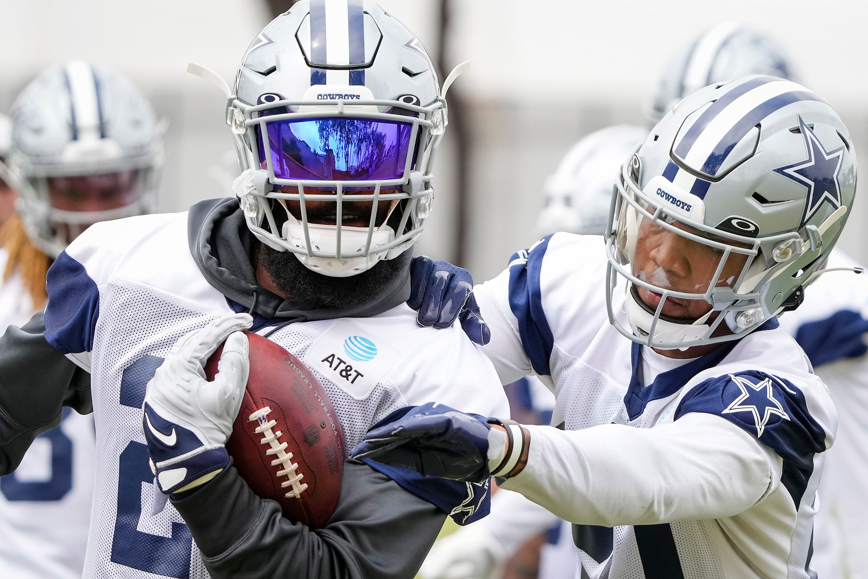 Dallas Cowboys running back Ezekiel Elliott (21) works against  running back Tony Pollard...