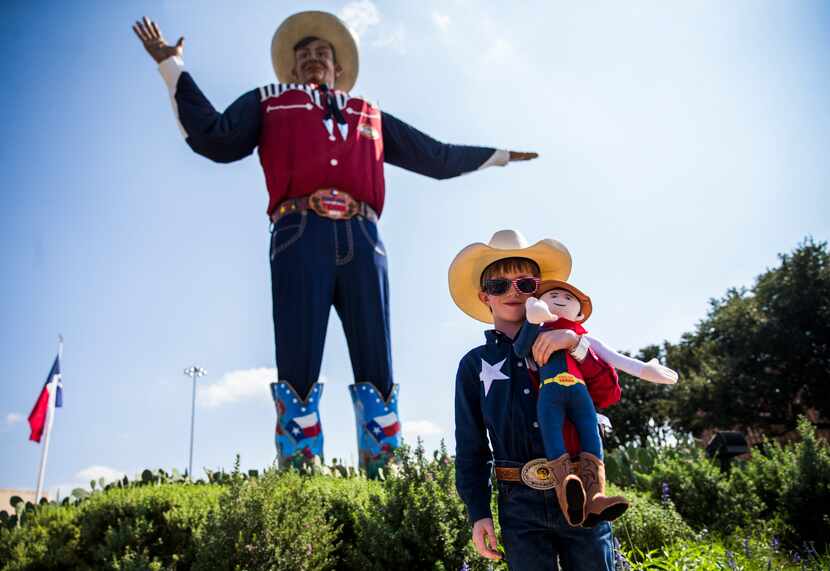 Isaiah Lee of Weatherford posed for a photo with Big Tex at the State Fair of Texas last...