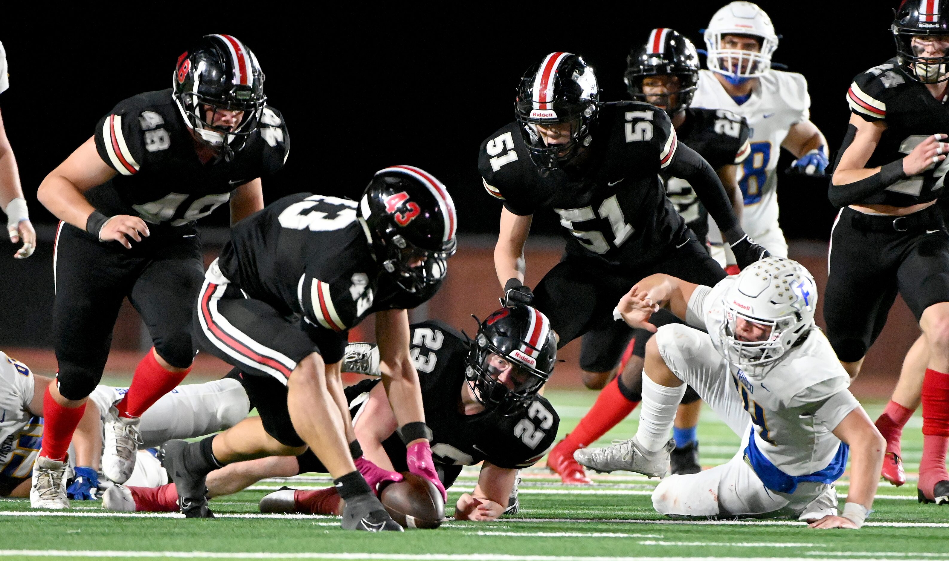 Lovejoy's Chase Bogle (43) recovers a fumble by  Frisco's Brandon Miyazono (14) in the...