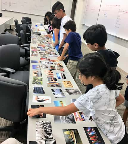 Students choose cards that tell something about themselves at the Be the Change South Asian...