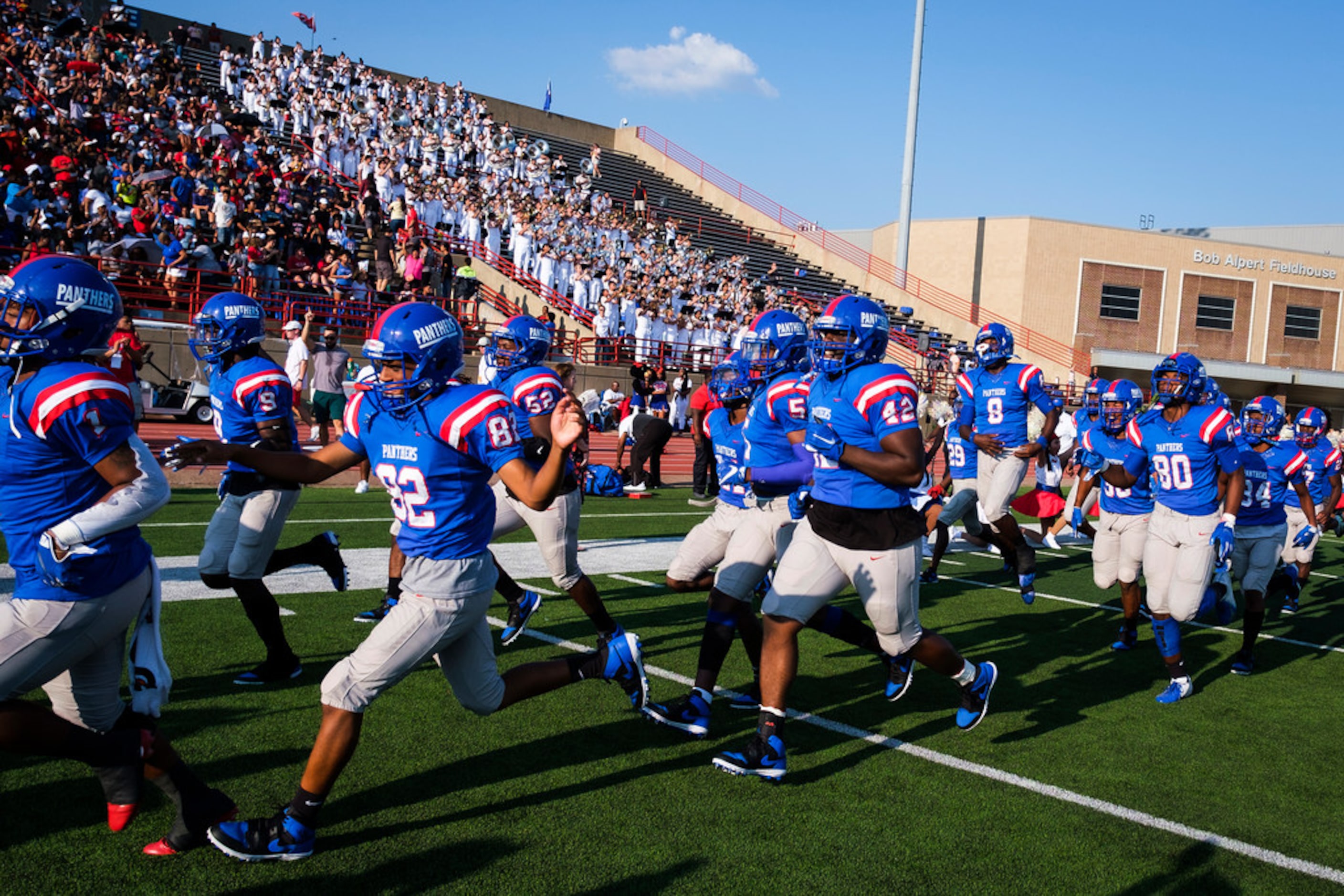 Duncanville players take the field to face St. John's College (D.C.) in a high school...