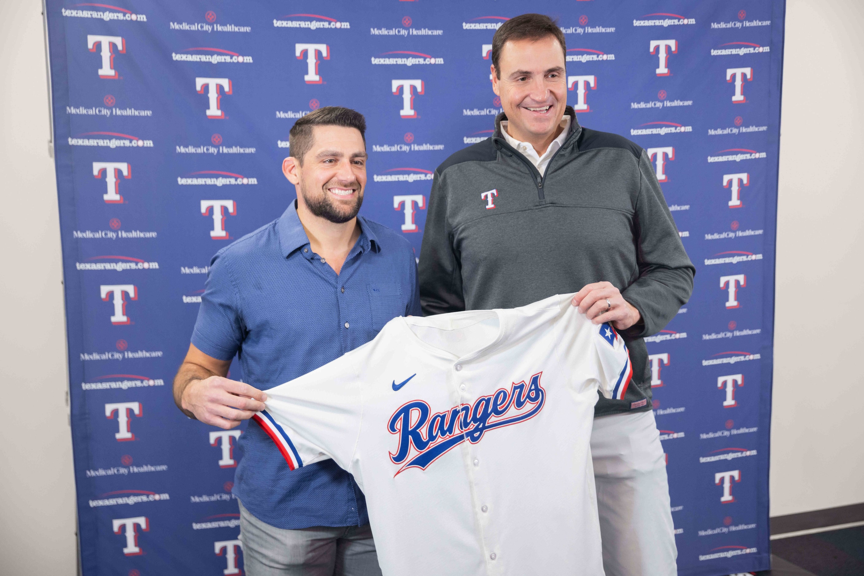 Texas Rangers starting pitcher Nathan Eovaldi (left) and Rangers GM Chris Young pose for a...