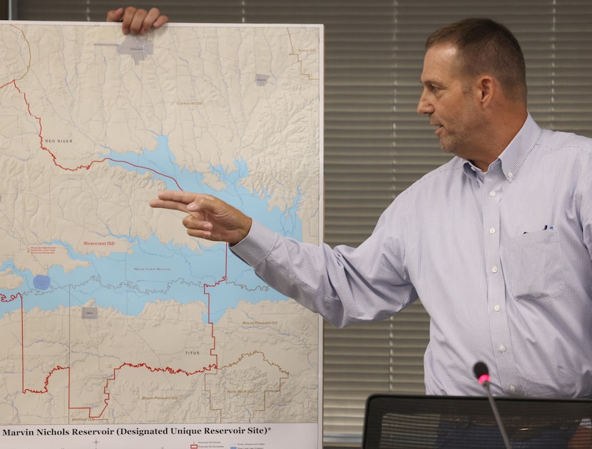 Stanley Jessee makes a reference to a map of Marvin Nichols Reservoir while sharing his...