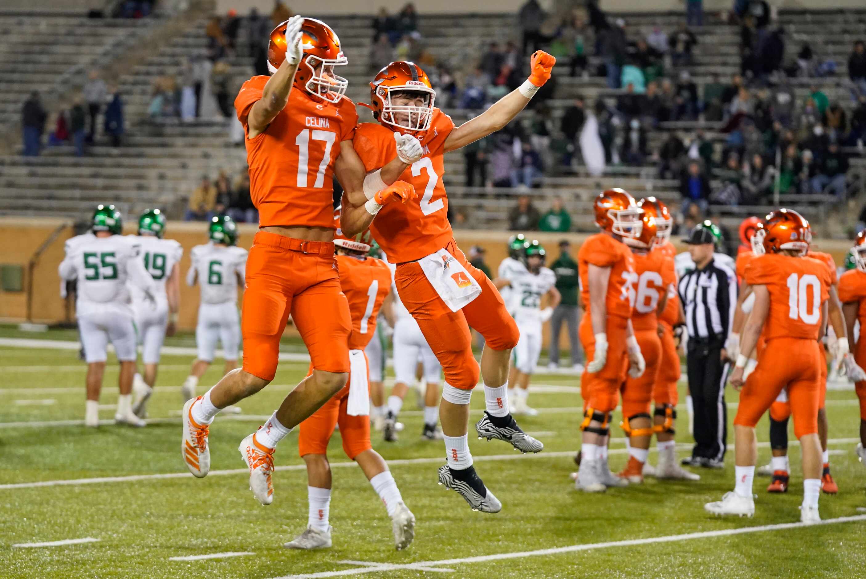 Celina wide receivers DJ Dell'Anno (17) and Collin Urich (2) celebrate in the final seconds...