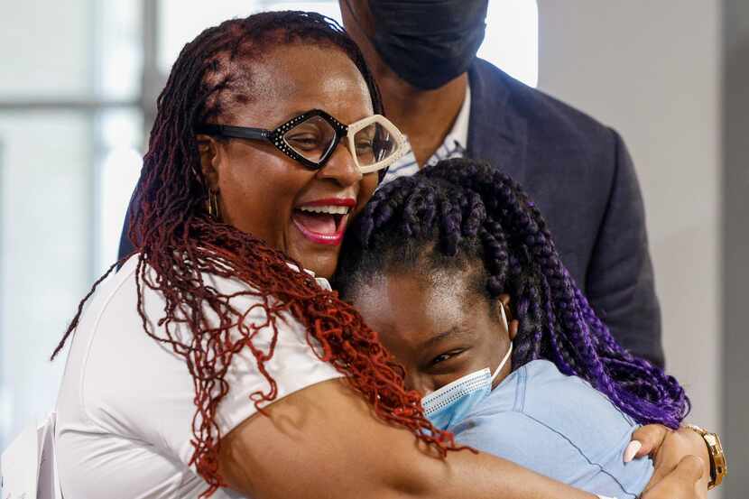 Teej Mercer, Move-in Day Mafia founder (left) hugs, Taylor Dixon, 18, after surprising her...