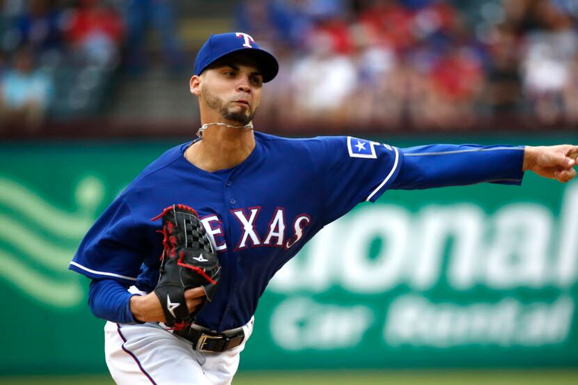 Texas Rangers relief pitcher Alex Claudio (58) pitches in the sixth inning against the Los...