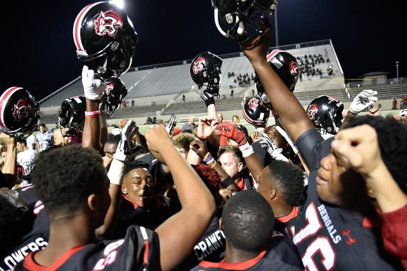 The Braswell High School football team celebrates after they defeat Wichita Falls at C.H....