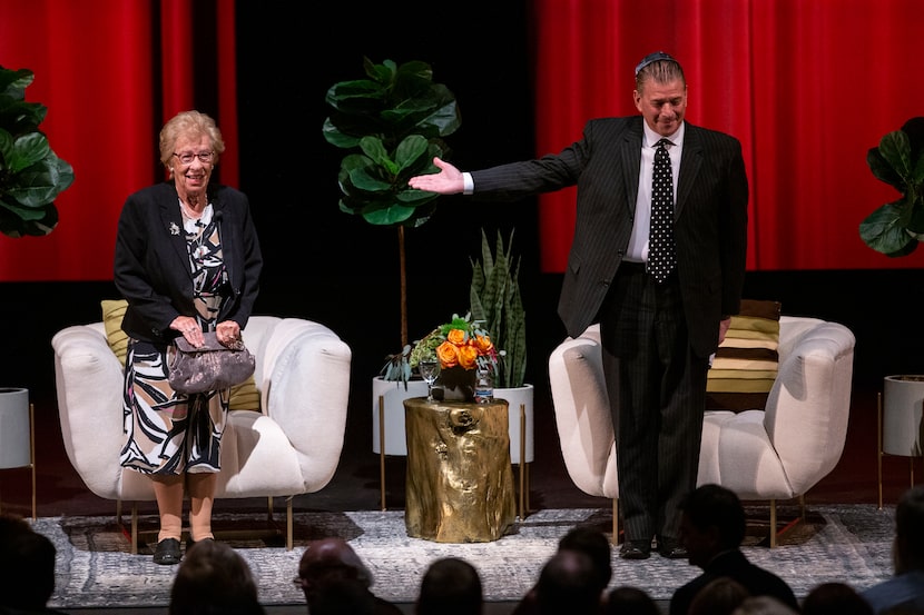 Moderator Mark Elfenbein (right) introduces Eva Schloss, a Holocaust survivor and stepsister...