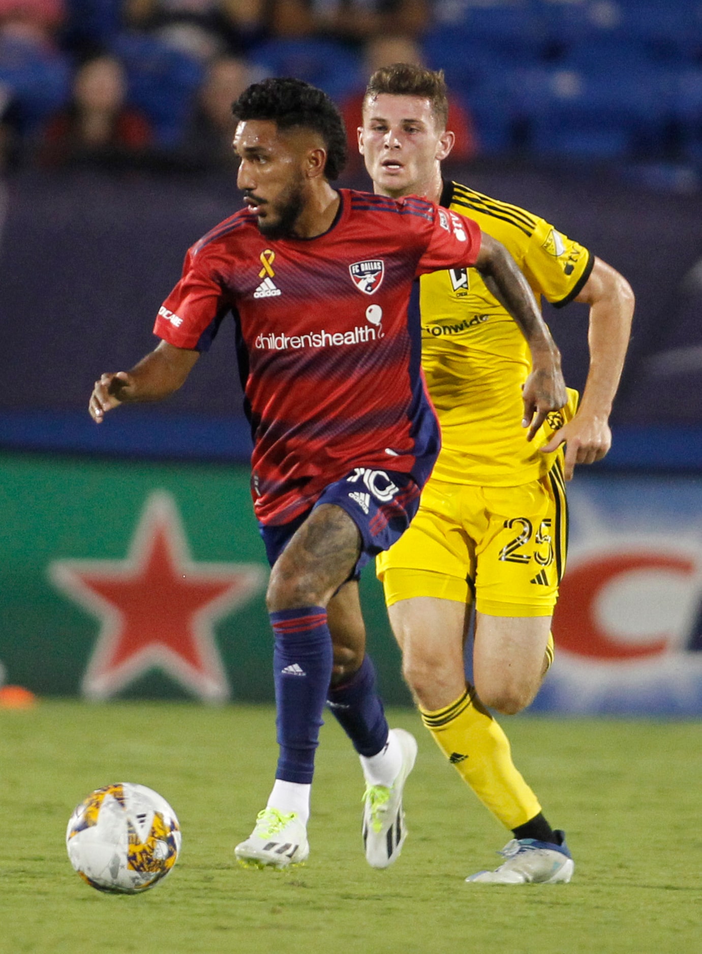 FC Dallas attacker Jesus Ferreira (10) controls the ball as he is followed by Columbus...