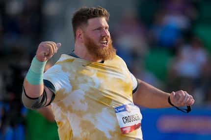 Ryan Crouser competes in the men's shot put final during the U.S. Track and Field Olympic...