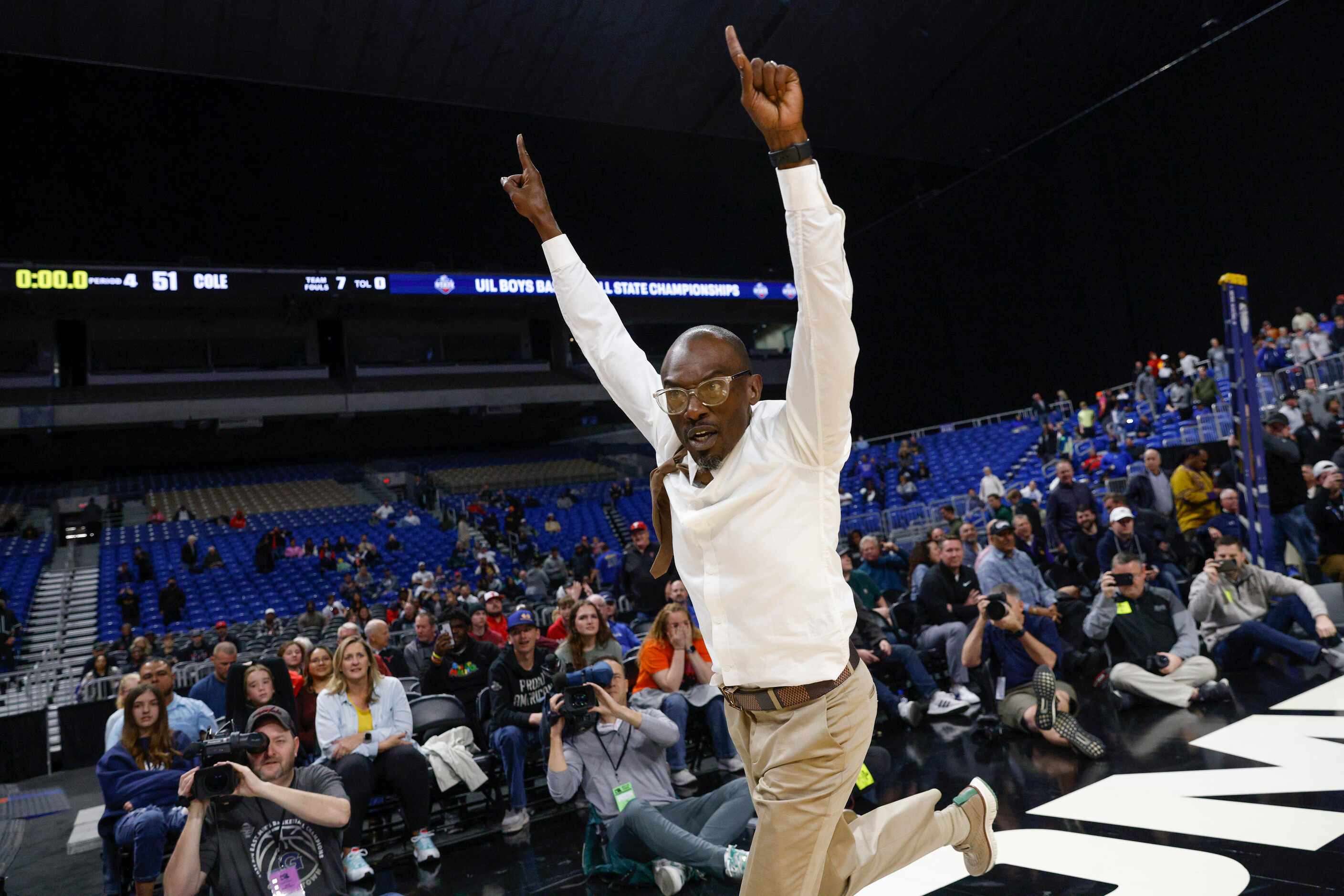 Madison head coach Damien Mobley celebrates winning the Class 3A state championship game...