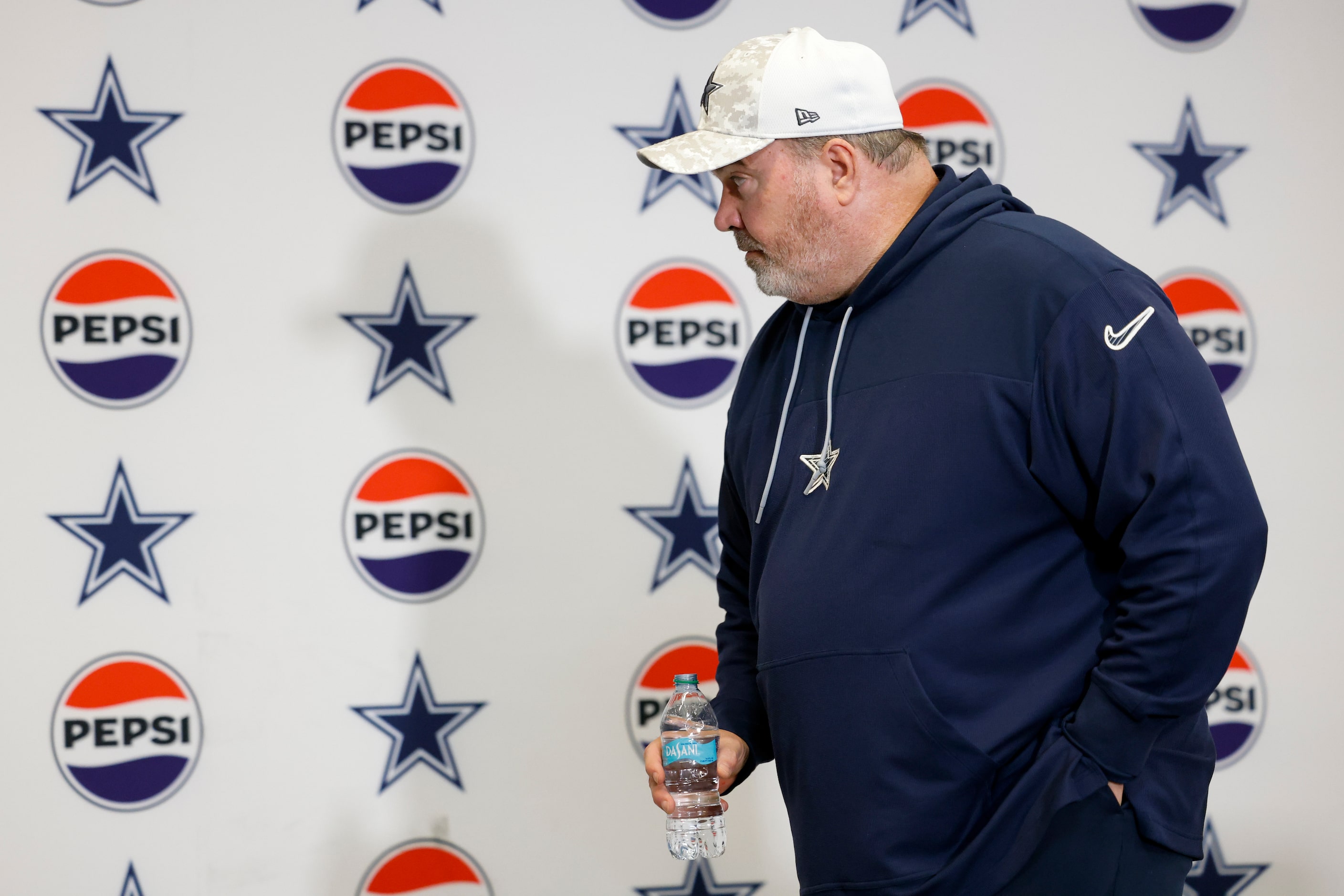 Dallas Cowboys head coach Mike McCarthy leaves the podium after a news conference following...